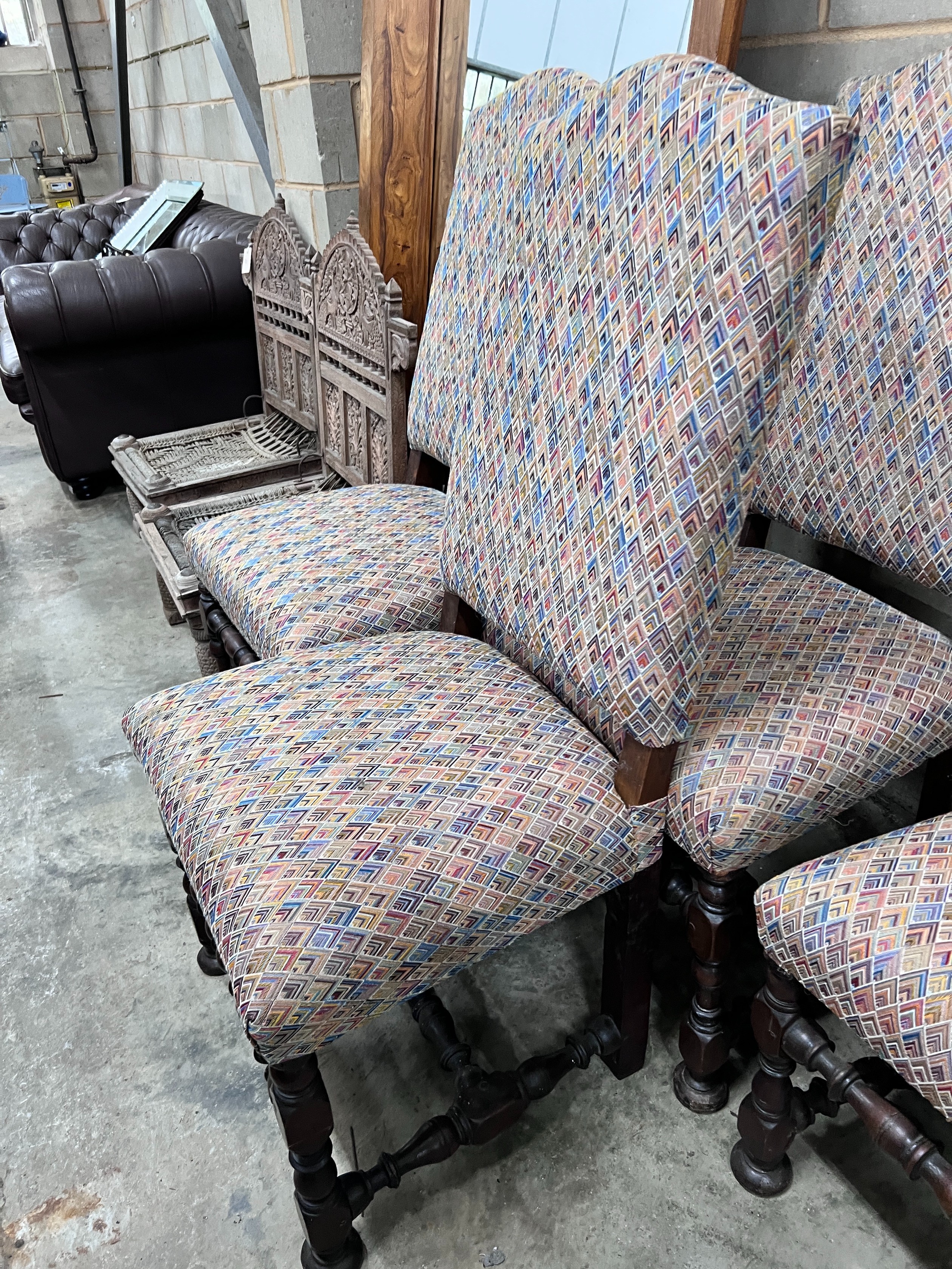 A set of four 17th century style Spanish walnut dining chairs, with upholstered backs and seats *Please note the sale commences at 9am.